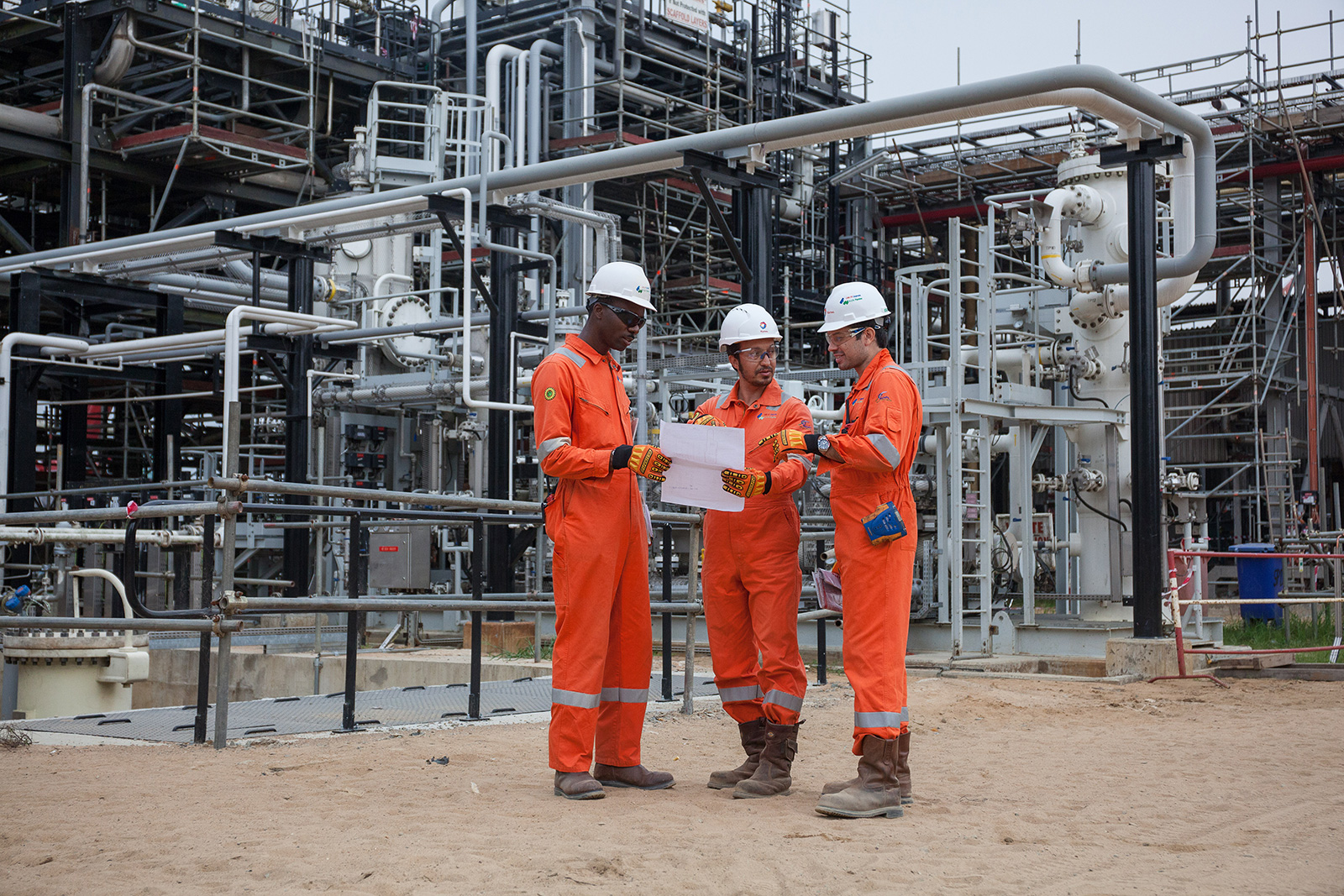 Operators carry out an inspection at a pumping station in Ogbogu, Nigeria.