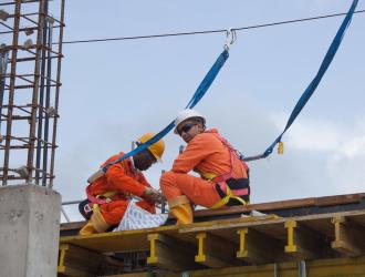 Operators with harnesses, Construction site