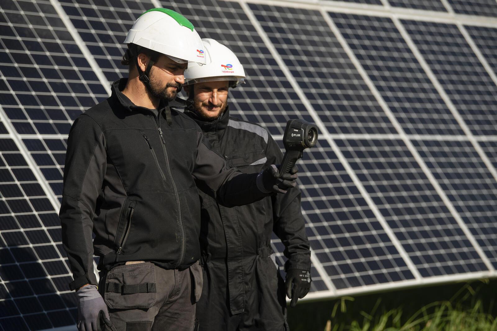 Employees at a solar power plant