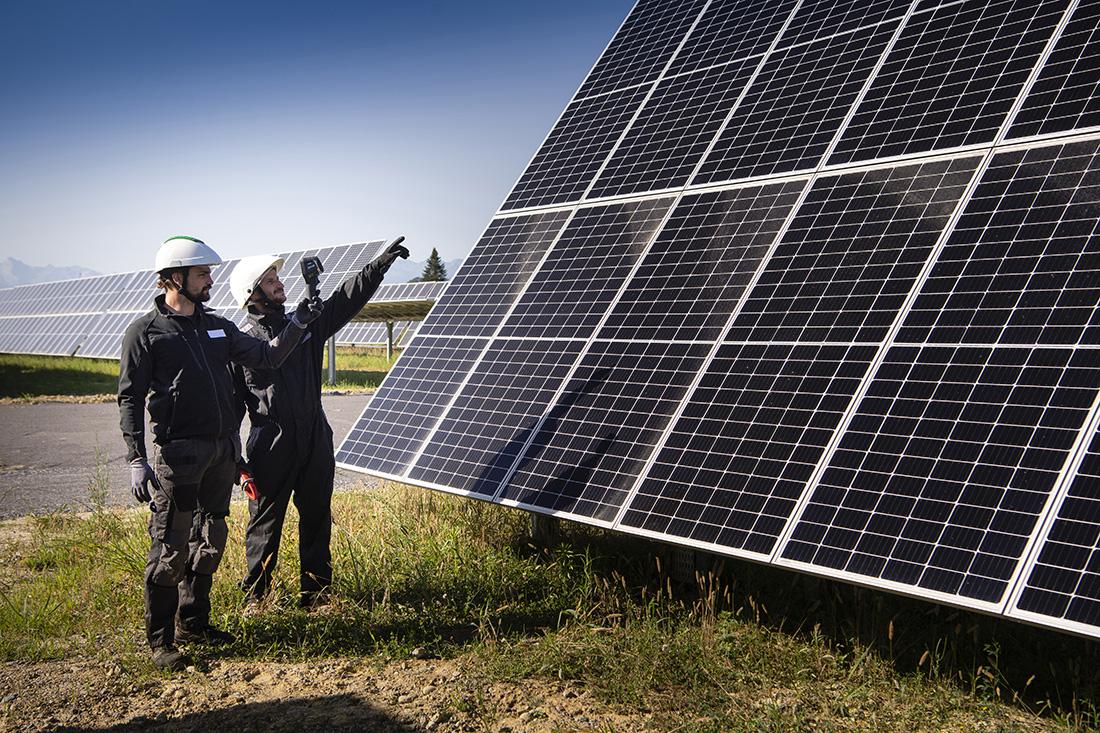 Employees at the Monein solar power plant in France