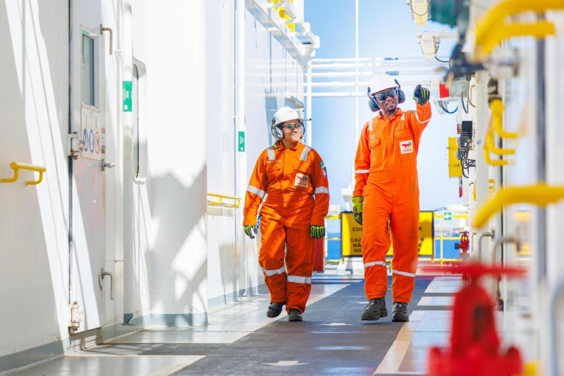 Two employees walking on the Valaris Renaissance (DS-15) rig on the Lapa field
